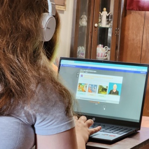SDPA STUDENT DOING SCHOOL WORK ON HER COMPUTER.