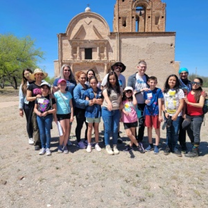 SDPA STUDENTS FIELD TRIP TO THE MISSION CHURCH. PICTURE OF TEACHERS, PARENTS AND STUDENTS STANDING IN FRONT OF THE CHURCH.