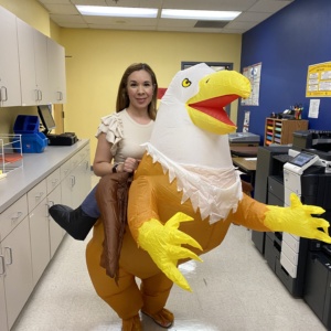 SDPA mascot which is Hashtag the Hawk with Ms. Yesenia Soto.