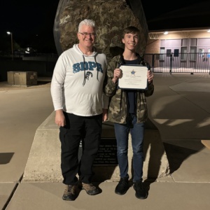 SDPA Teacher, Mr. Eves giving a certificate to one of his SDPA student.