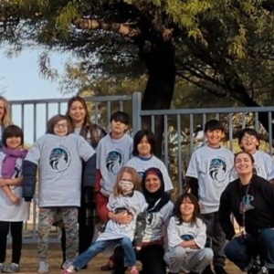 Image of SDPA Elementary students. Standing in front of a tree.